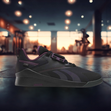 Black and purple Reebok Lifter PR 3 weightlifting shoe with a low-profile design and slightly elevated heel, displayed in a gym environment