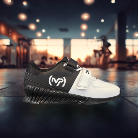 Black and white Kcross weightlifting shoe with dual straps and elevated heel, designed for squat stability, displayed in a gym setting