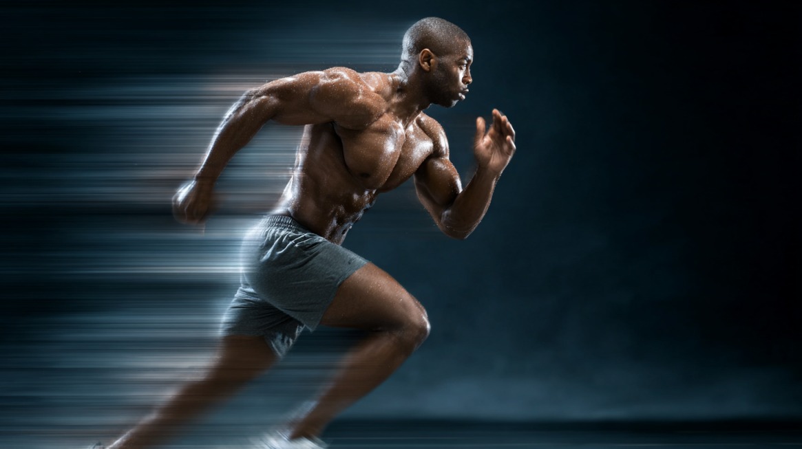 Athlete sprinting intensely with motion blur showing speed